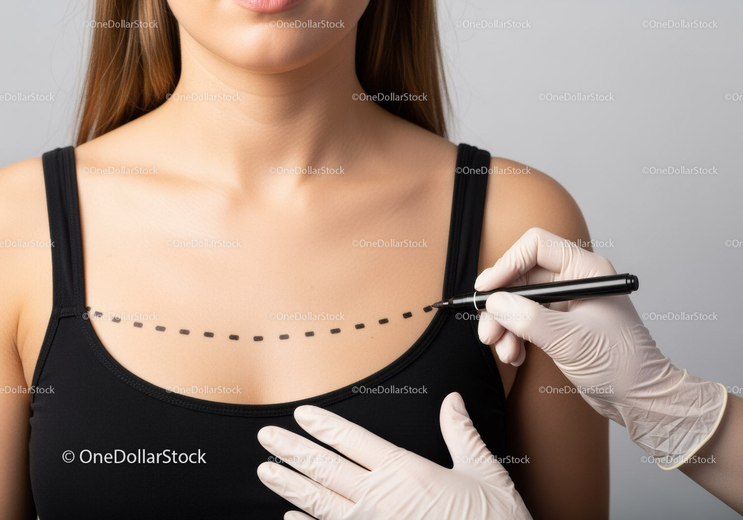 Woman Preparing for Breast Enhancement Surgery with Medical Professional