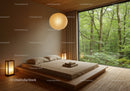 Minimalist bedroom with forest view and warm lighting