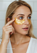 Close-up of Woman with Gold Eye Patches for Skincare Treatment