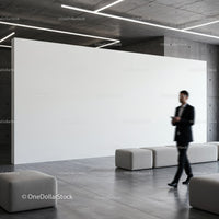 Businessman walking in modern minimalistic lobby space