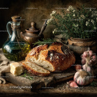 Rustic loaf of bread with garlic and herbs on wooden cutting board