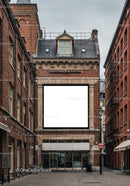 Historic brick building with blank billboard in narrow street