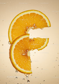 Fresh orange slices with water droplets on beige background