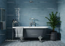 Modern freestanding bathtub in stylish blue bathroom