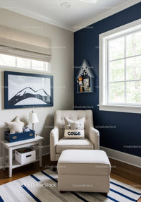Modern Nursery Room with Blue Accent Wall and Cozy Armchair
