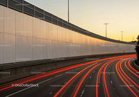 City Highway with Light Trails During Sunset in Urban Environment