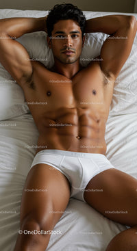 Fit young man relaxing on bed in white underwear