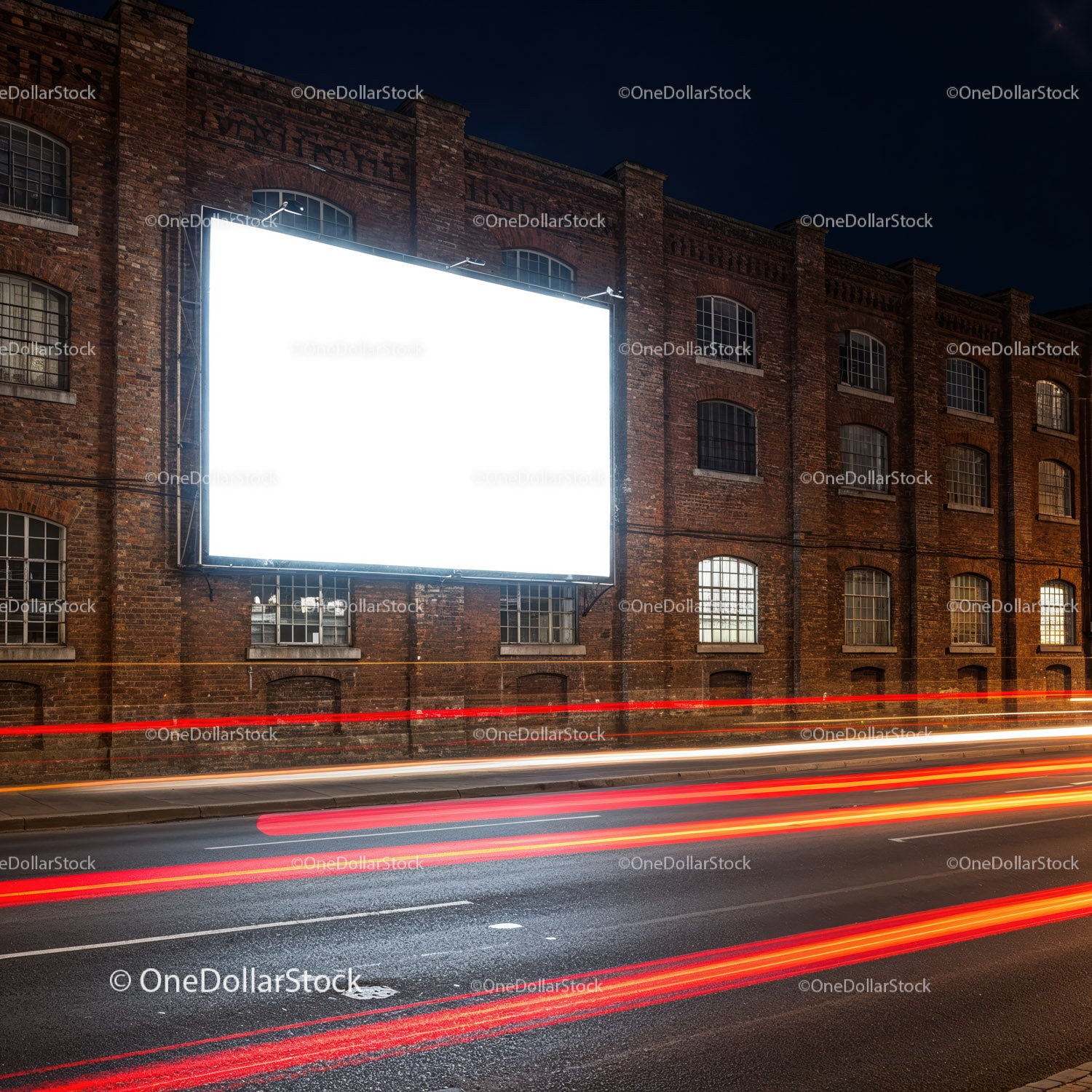 Blank Billboard on Brick Wall with Light Trails at Night