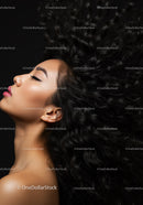Profile of serene woman with flowing curly hair