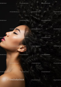 Profile of serene woman with flowing curly hair