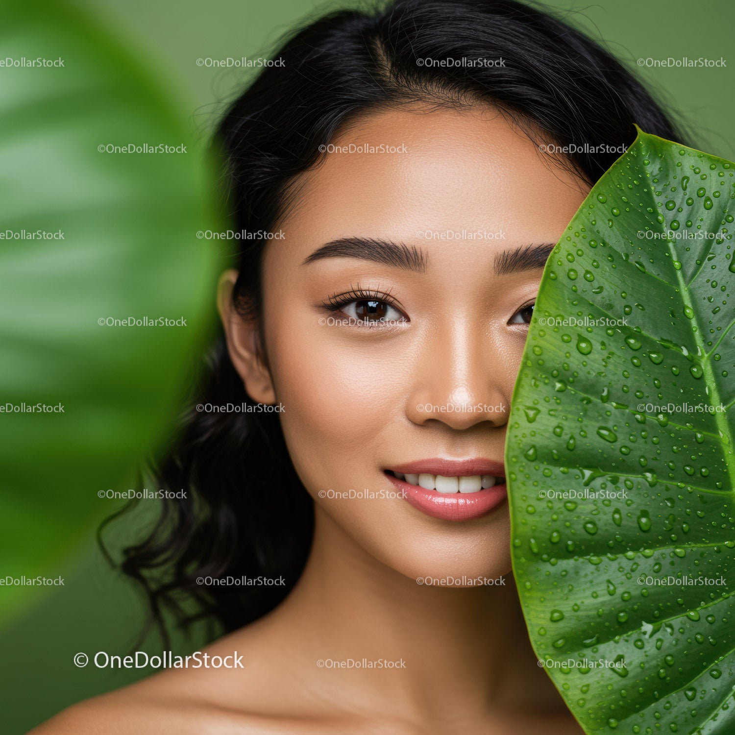 Beautiful Woman with Tropical Leaf and Lush Greenery Background