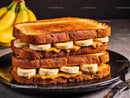 Banana and Peanut Butter Toast Sandwich on Black Plate