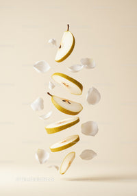 Floating slices of ripe pear with delicate white petals
