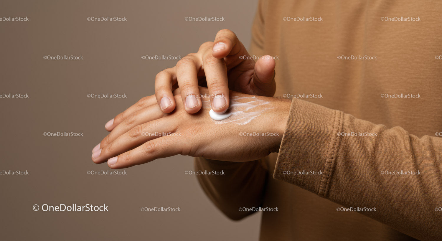 Close-up of Hand Applying Moisturizing Lotion for Skin Care