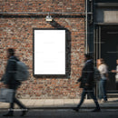 Blank poster on brick wall with blurred pedestrians walking