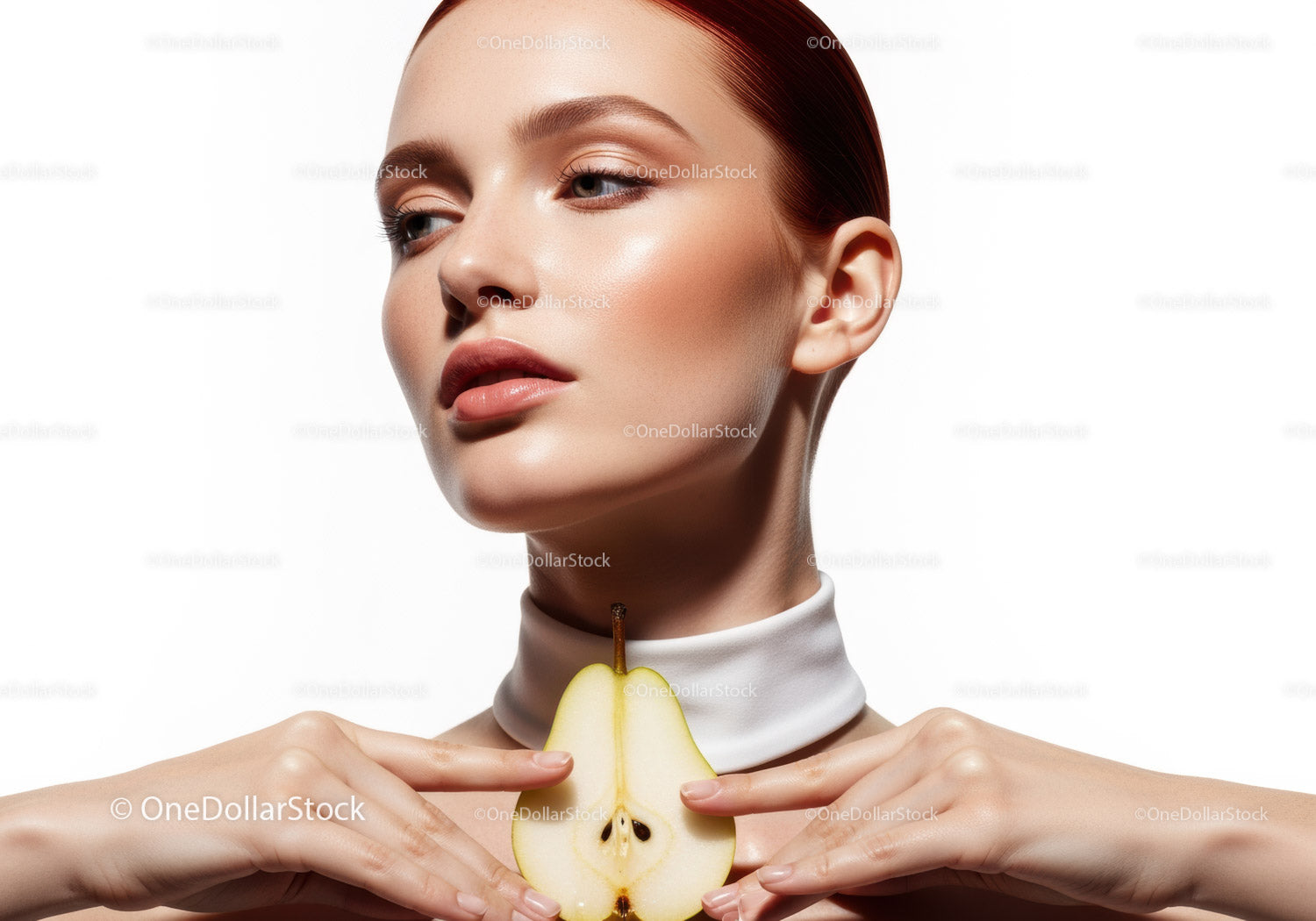 Elegant Woman with Flawless Skin Holding a Pear in Studio Shot