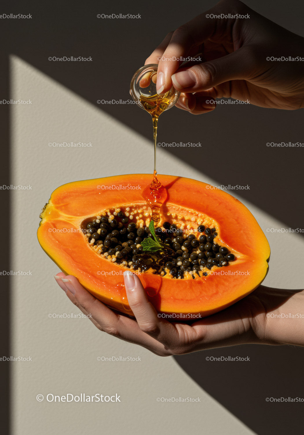 Honey Drizzling Over Fresh Halved Papaya Held by Hand