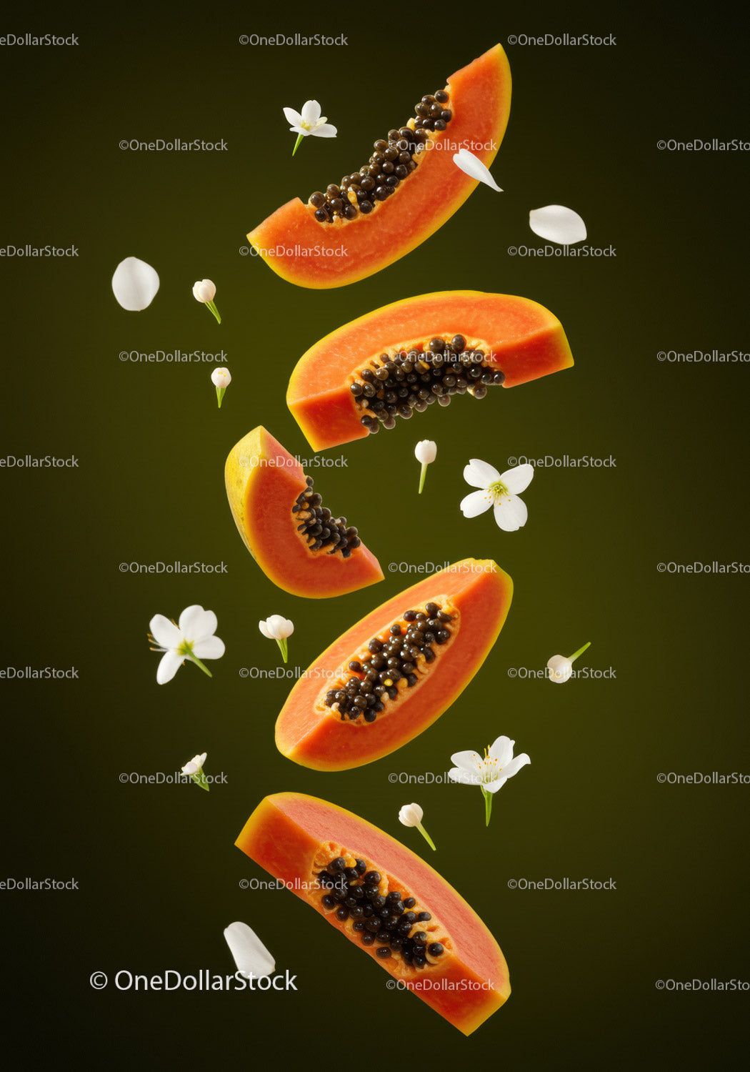 Fresh papaya slices with floating white flowers