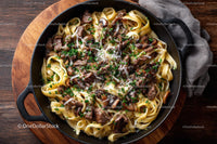 Beef Stroganoff with Mushrooms and Fettuccine on Wooden Table