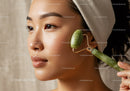 Woman Receiving Facial Massage with Jade Roller for Glowing Skin