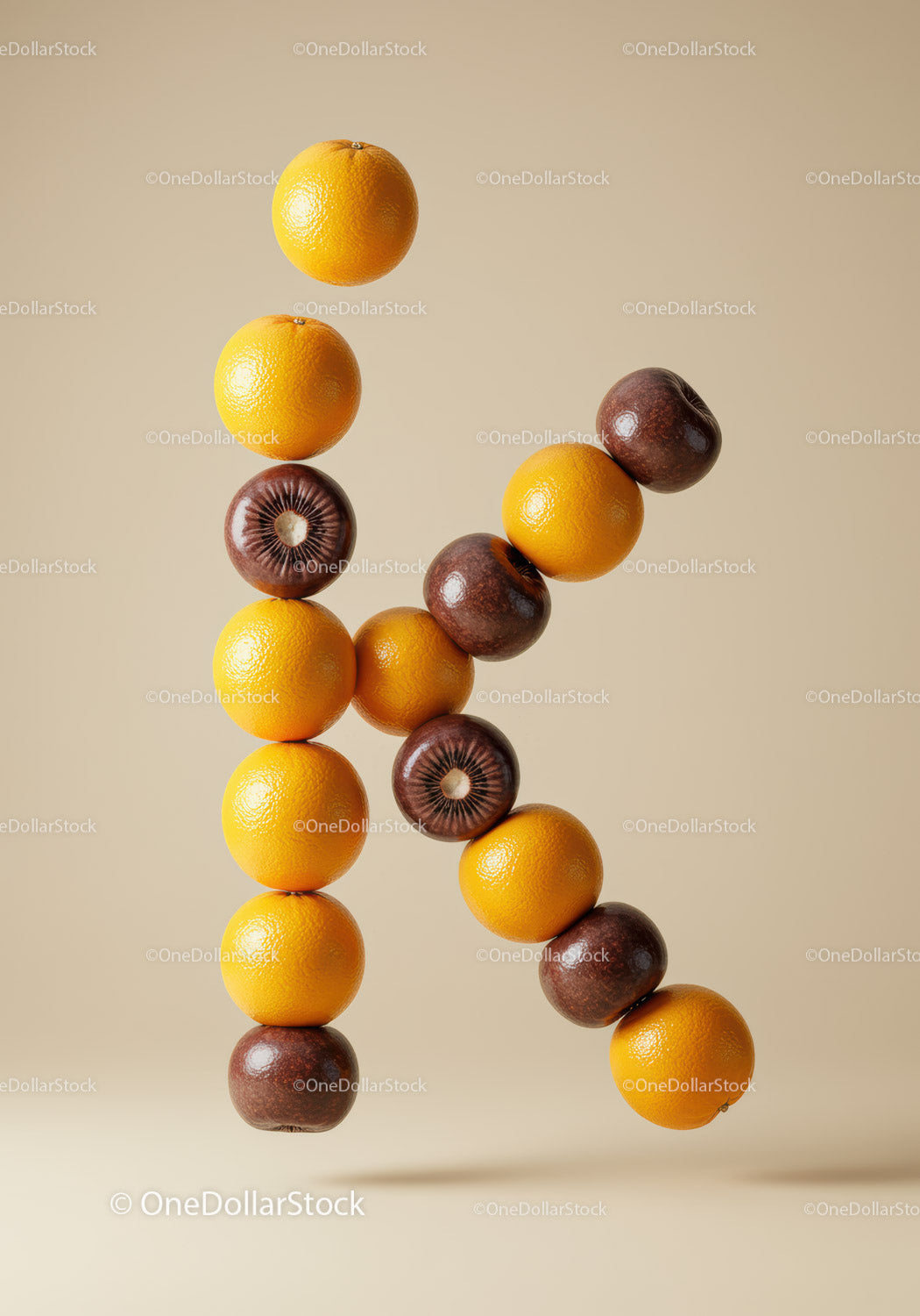 Creative letter K made from oranges and kiwis
