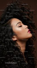 Profile of woman with curly hair and pink lipstick