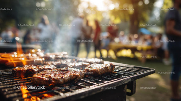 Grilled Steaks on Outdoor Barbecue Grill at Summer Picnic