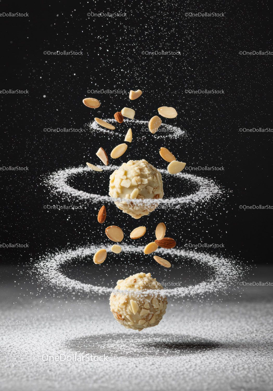 Almond truffles with powdered sugar and nuts spirals