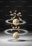 Almond truffles with powdered sugar and nuts spirals