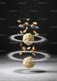 Almond truffles with powdered sugar and nuts spirals
