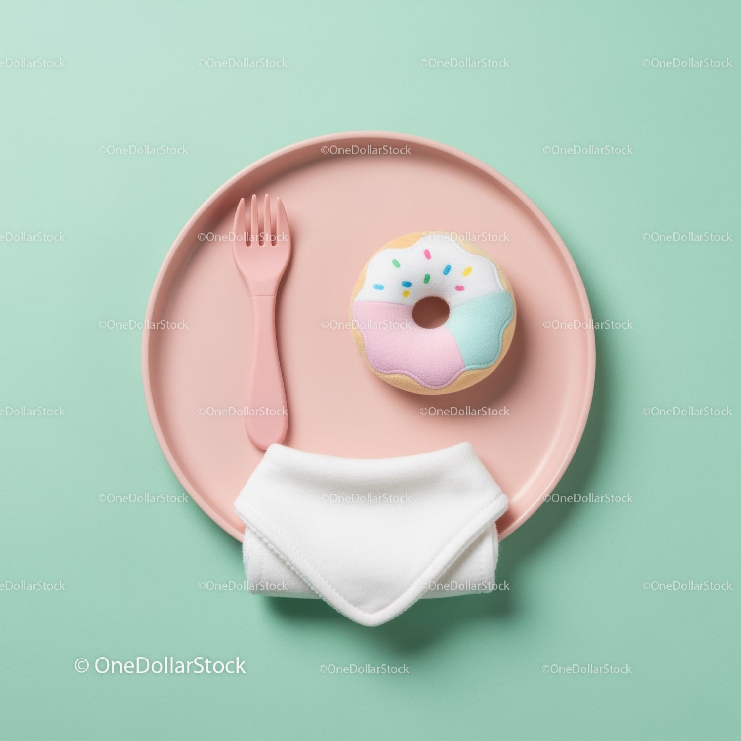 Pastel baby feeding set with donut toy on plate