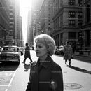 Elegant Elderly Woman Walking in Busy City Street in Classic Fashion