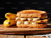 Banana and Peanut Butter Sandwich on Rustic Wooden Surface
