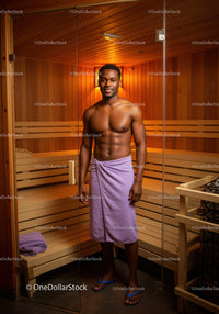 Young Man Relaxing in Sauna Interior with Wooden Walls and Ambient Lighting