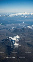 Aerial View of Snow-Capped Volcano in Mountain Range