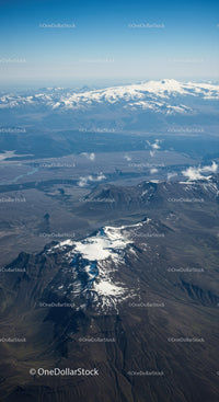 Aerial View of Snow-Capped Volcano in Mountain Range