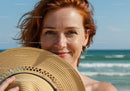 Young Woman with Red Hair and Straw Hat at Beach