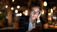 Young Woman with Glasses Using Smartphone At Night