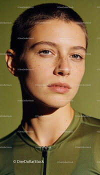 Close-up of athlete with short hair in green sportswear
