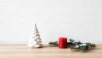 Minimalist Christmas decor with candle and ceramic tree