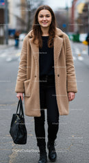 Young Woman in Cozy Coat Walking on City Street with Confidence