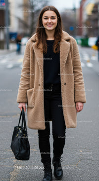 Young Woman in Cozy Coat Walking on City Street with Confidence