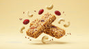 Two Granola Bars with Nuts and Dried Cranberries Floating