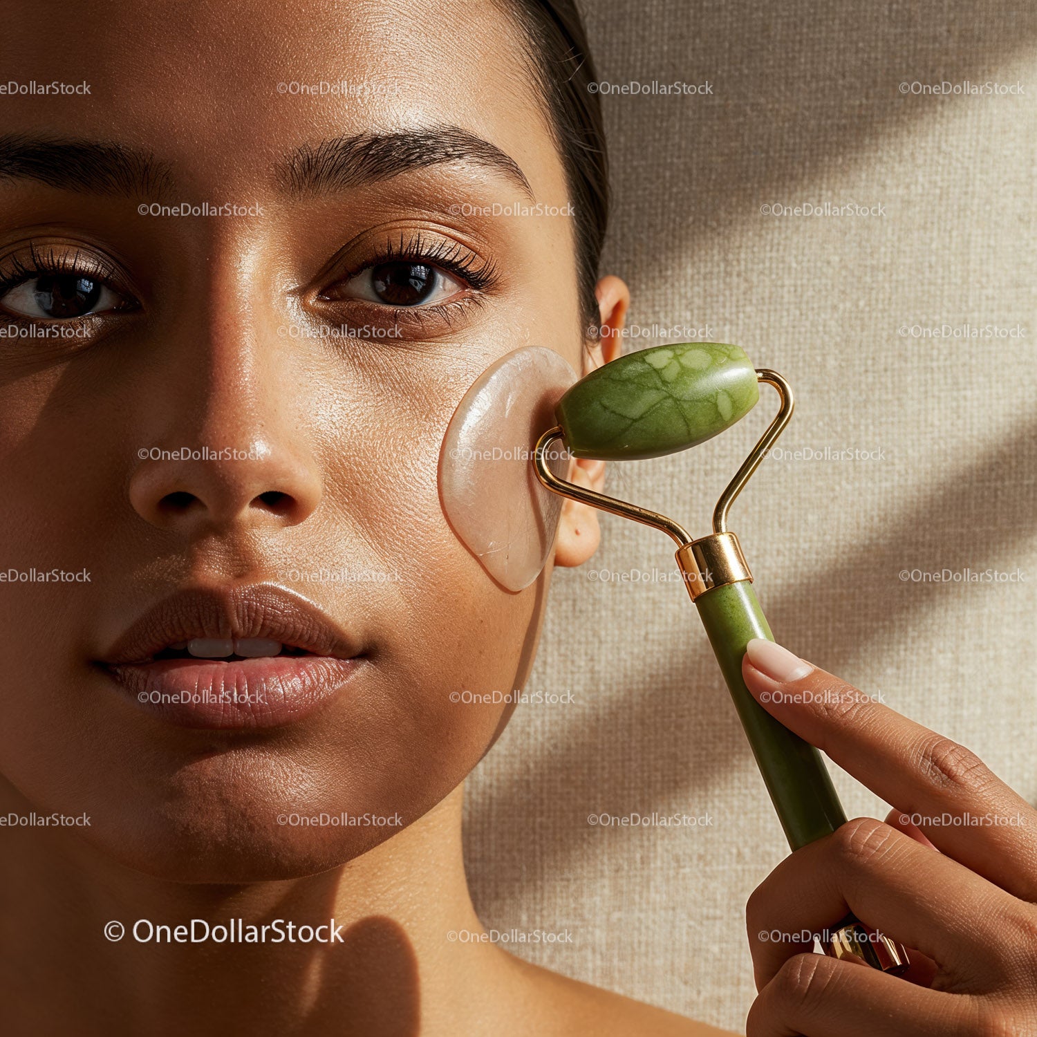 Young Woman Using Jade Roller for Facial Skin Tightening and Rejuvenation