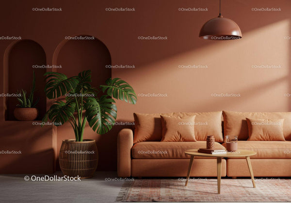 Nowoczesny salon z różową sofą i zieloną rośliną Monstera