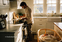 Father Preparing Breakfast While Baby Sleeps Nearby