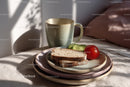 Ceramic Mug and Fresh Vegetables on Rustic Dinnerware