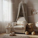 Cozy nursery corner with armchair and large teddy bear