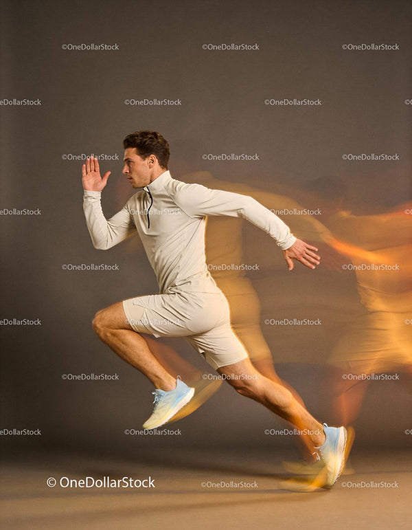 Athletic young man sprinting with motion blur effect