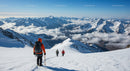 Snowy Mountain Trek with Hikers Under Clear Blue Sky